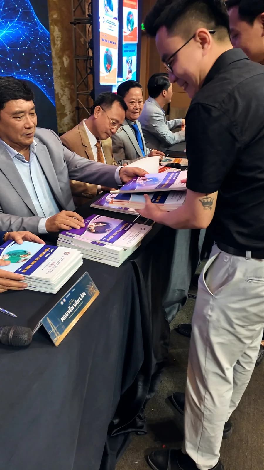 Authors signing copies