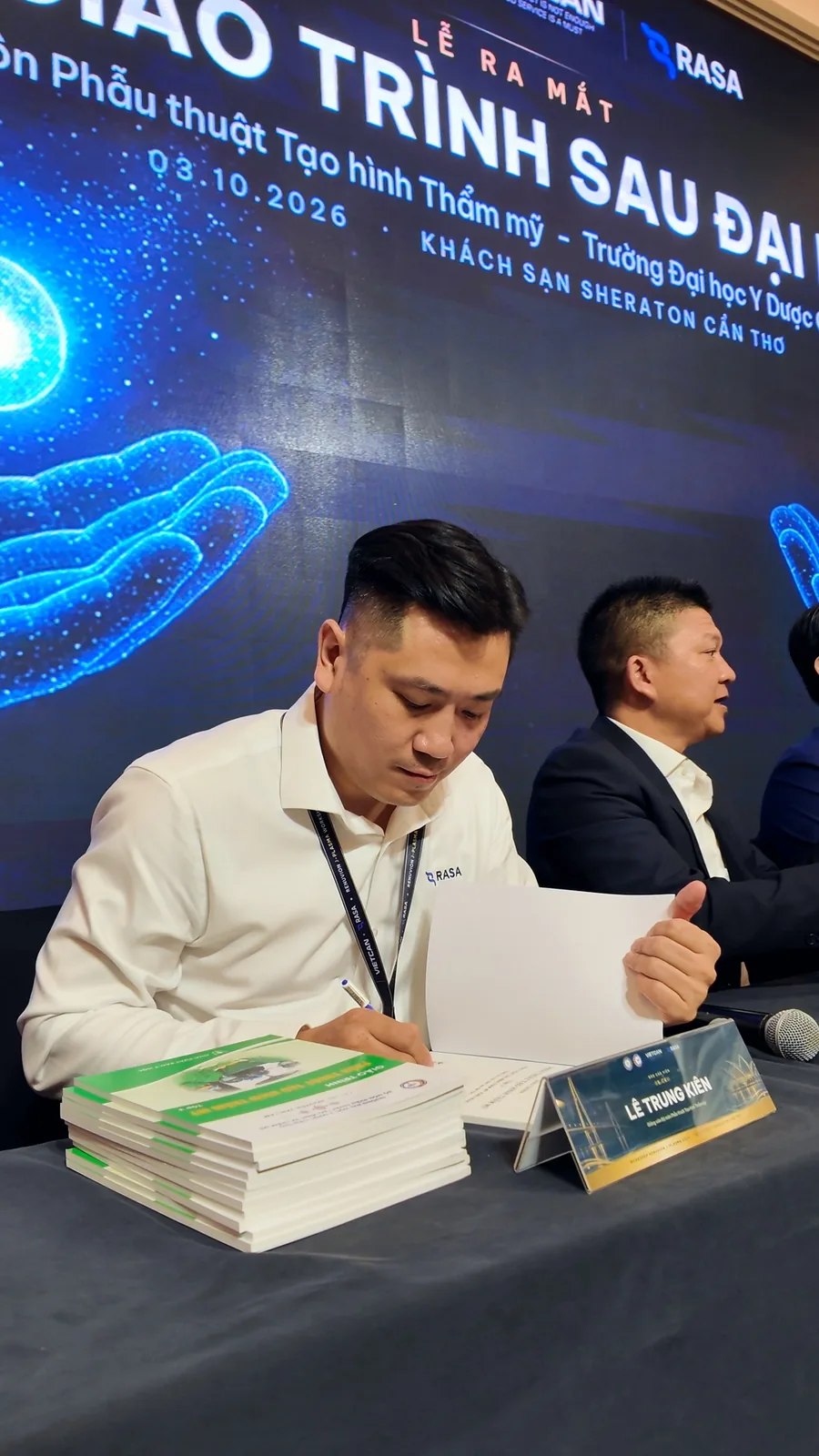 Dr. Kien at the signing table