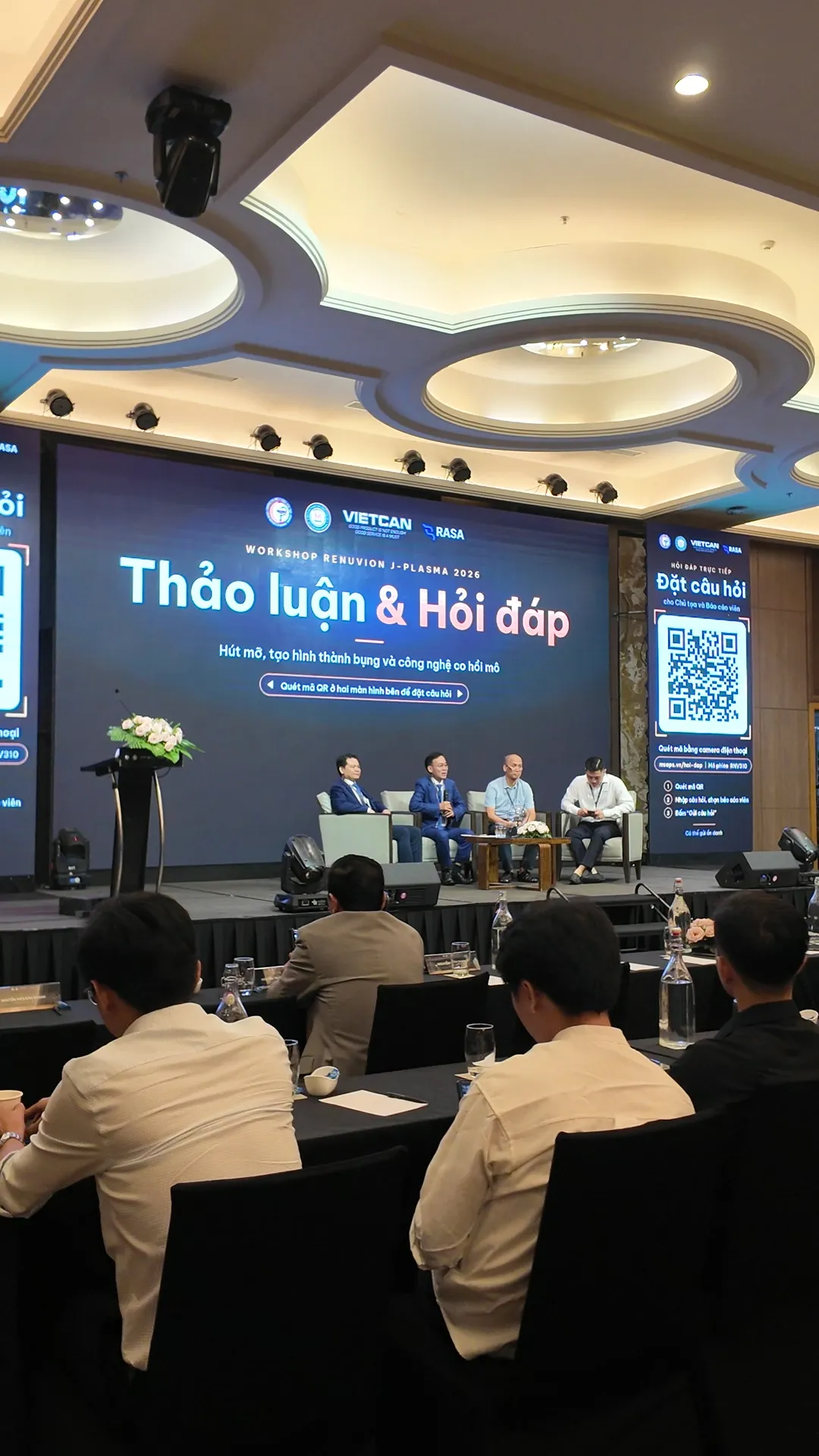 The chair and speakers during the discussion and Q&A session